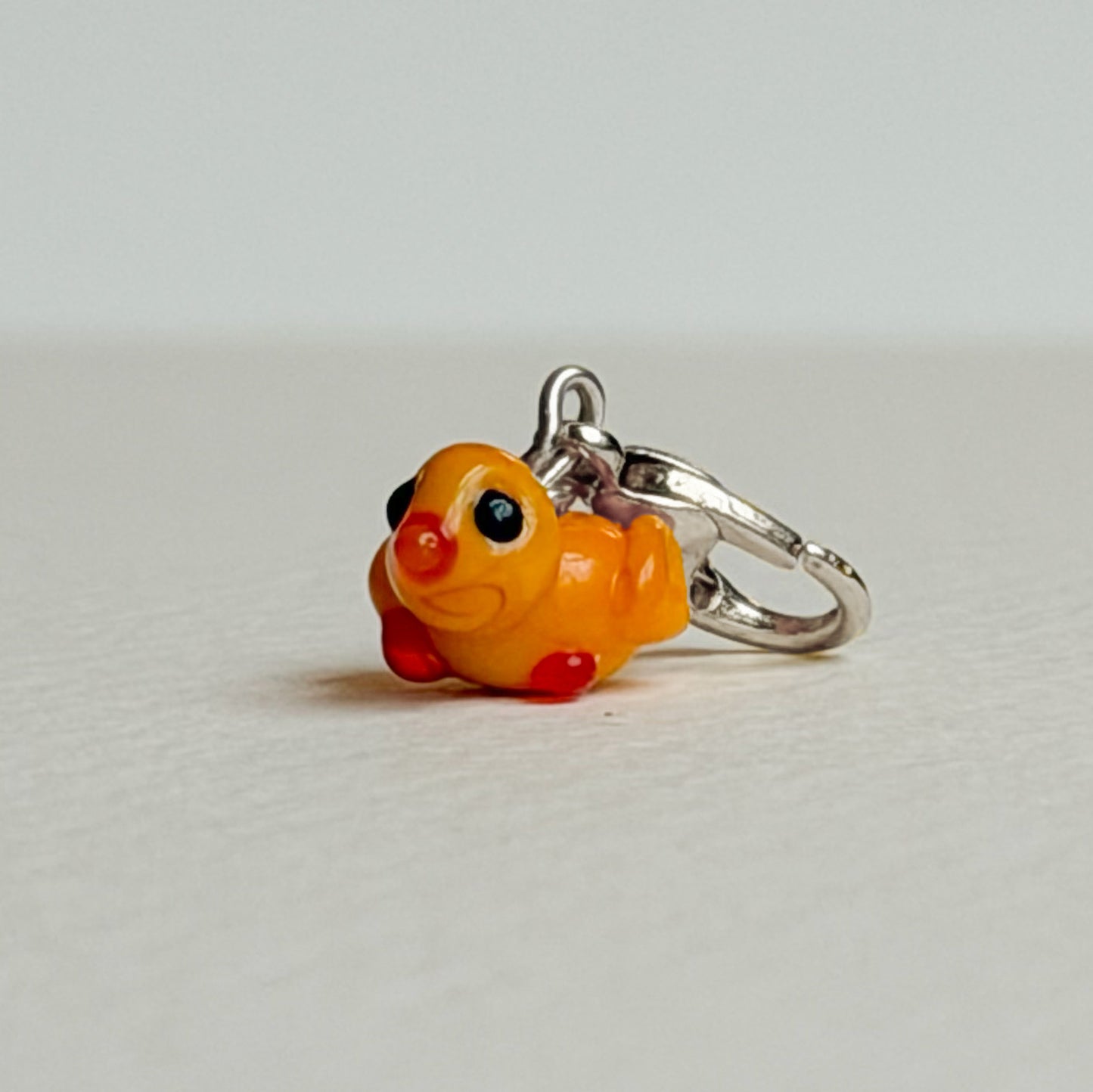 Small yellow duckling charm with silver hardware